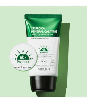 Tube of Truecica Mineral Calming Tone-Up Suncream with a green and white design on a light green background