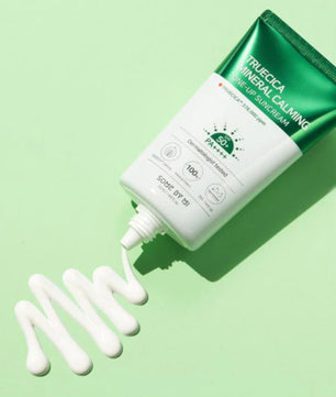 Truecica Mineral Calming Sunscreen on a green background