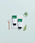 Two bottles of Truecica Pure All-In-One on a light blue background with green leaves and a wooden spoon.