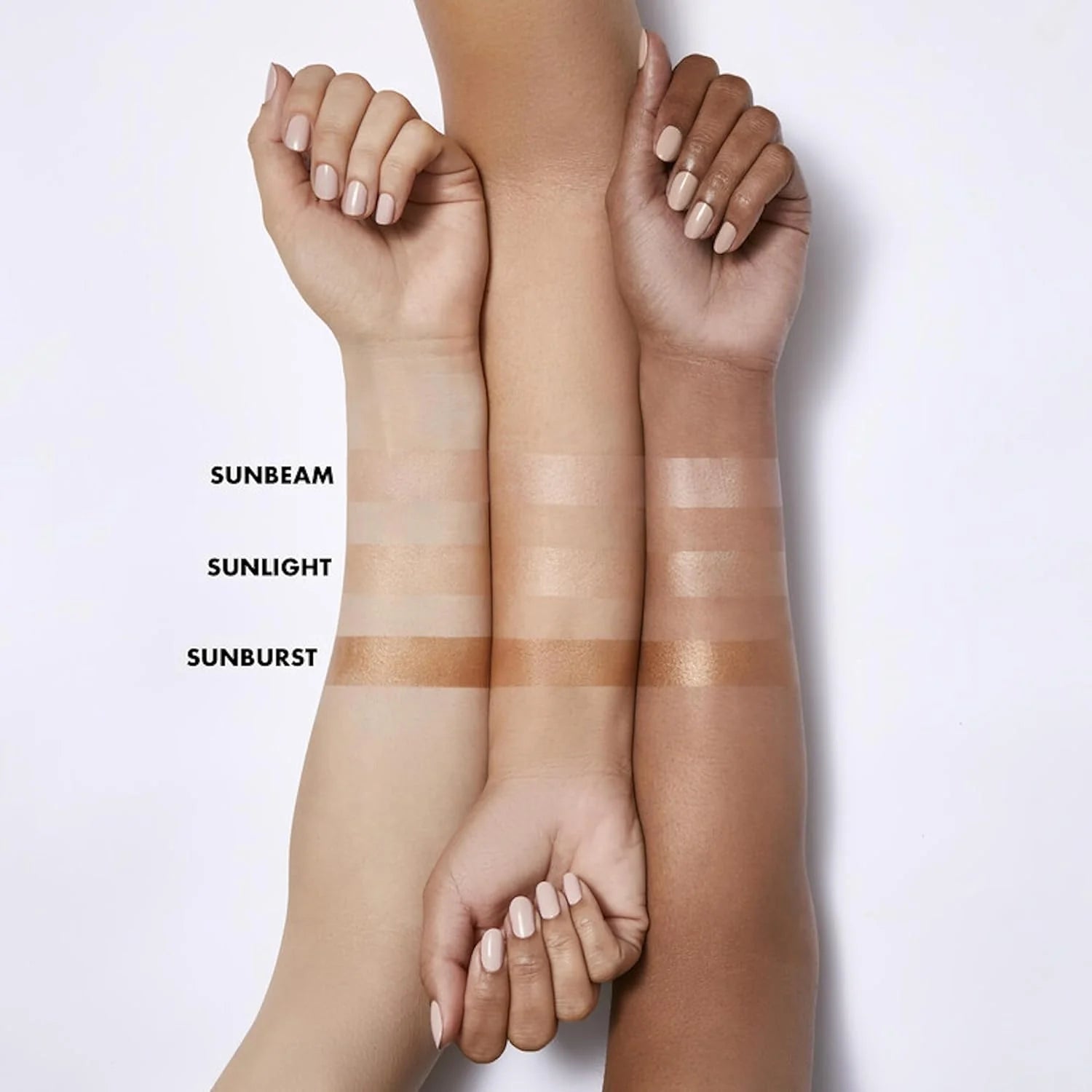 Three arms with different skin tones holding swatches labeled 'Sunbeam', 'Sunlight', and 'Sunburst' on a white background.
