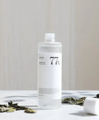 Clear bottle with text on a light background
