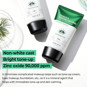 Two sunscreen products with green and white packaging on a light gray background.