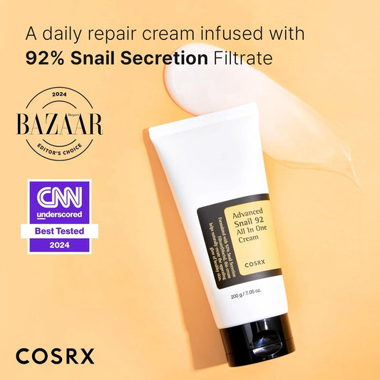 Cosrx cream tube with snail secretion filtrate on a beige background, featuring Bazaar and CNN logos.