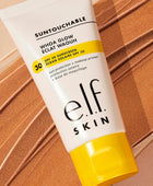 Tube of e.l.f. Skin sunscreen on a brown background