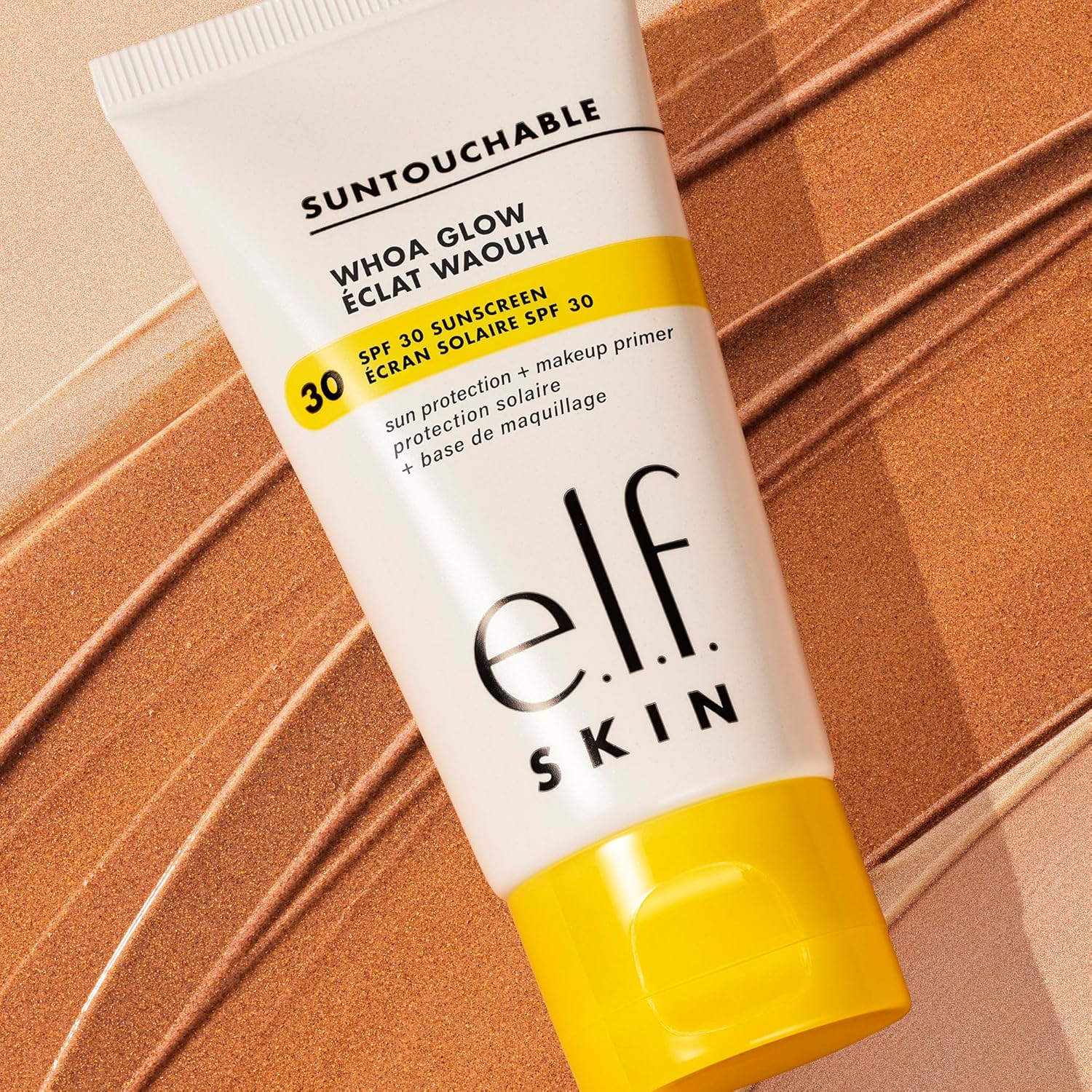 Tube of e.l.f. Skin sunscreen on a brown background