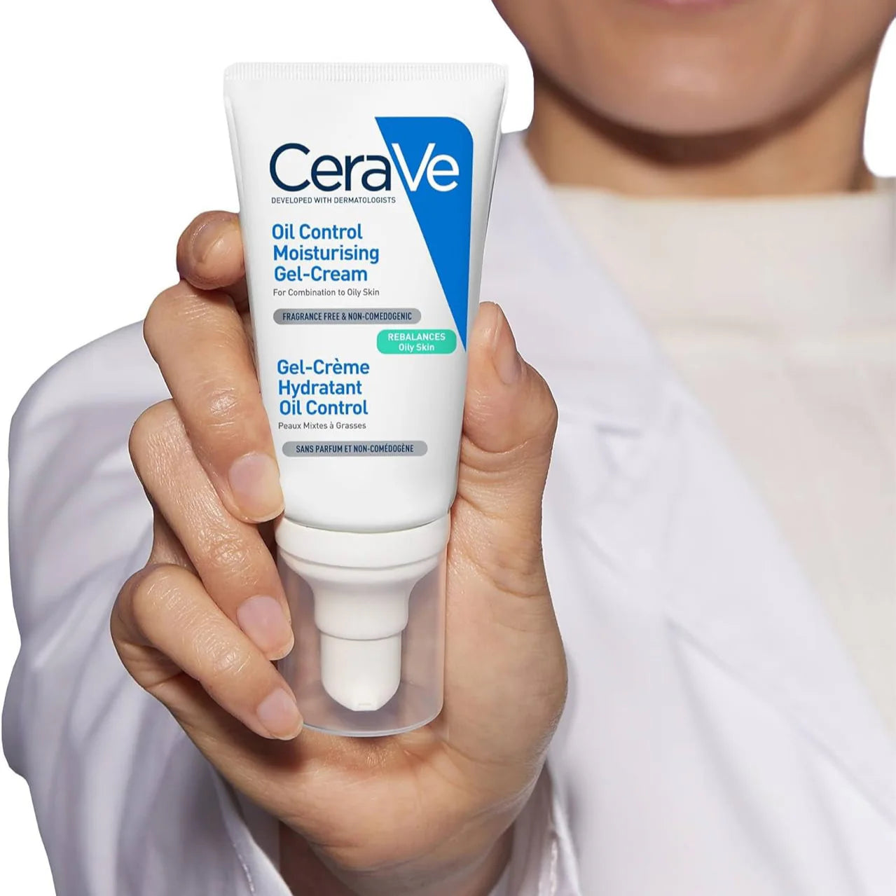 CeraVe oil control moisturizing gel-cream held in a hand with a blurred background