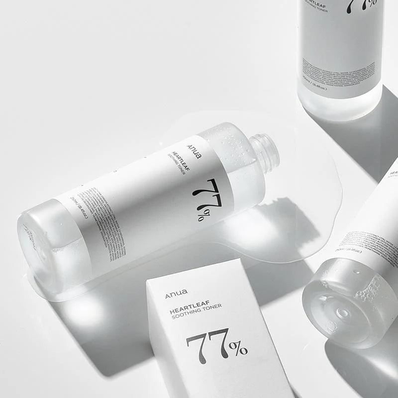 Skincare products with '77%' branding on a light gray background