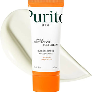 Purito Daily Soft Touch Sunscreen with orange cap and white label on a white background
