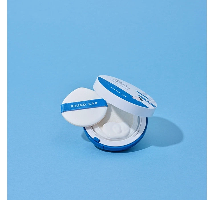 Round Lab compact powder on a light blue background